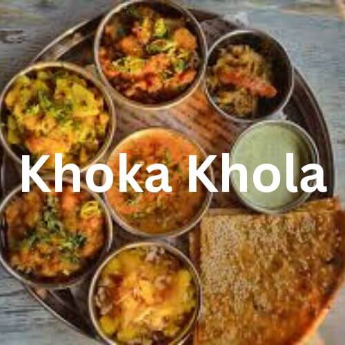 Khoka Khola meal platter with a variety of dishes including rice, daal, curries, and naan, beautifully arranged on a traditional plate. Khoka Khola Menu and South Islamabad Eats.