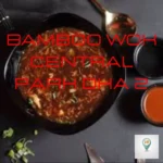 alt="Bamboo Wok Central Park DHA 2 featured by SouthIslamabadEats, showing a bowl of saucy Asian food with red text overlay on a dark background"